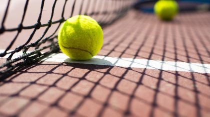 Tennis ball lying on the court. Healthy lifestyle concept