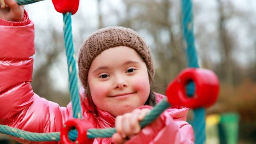 Portrait of beautiful girl on the playground